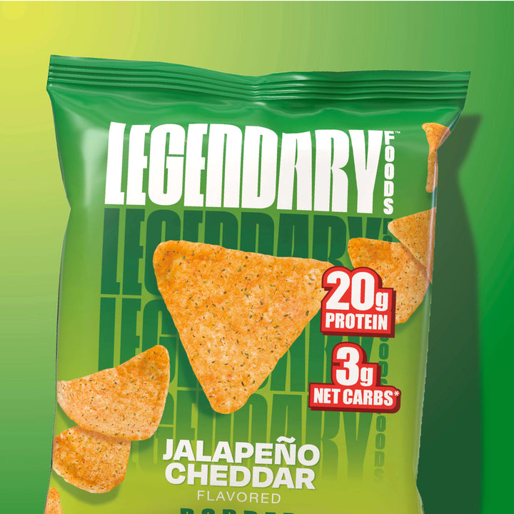 Green bag of Legendary Foods Jalapeño Cheddar Popped Protein Chips, featuring 20g protein, 3g net carbs, and an image of triangular chips.